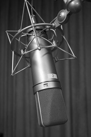 Black and white photograph of a U87 microphone